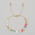Adjustable woven bracelet with faux pearls, gold heart, star charms, and letter X bead - Letter X Style (ZZ-B24061901X-F)
