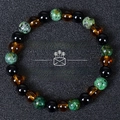 Detail of money success bracelet with tiger eye and turquoise beads on black background - Green Spotted Stone/Amber Bead/Black Bead (Money Success-8)