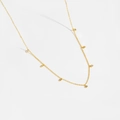 Detail of a minimalist gold S925 silver necklace with sparkling round zircon pendants - 925 Silver / 7-Pendant 18K Gold Style (MMN045-2)