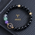 Macro shot of 8mm Aries zodiac bracelet with black obsidian beads and blue goldstone - Aries