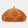 Detailed texture of caramel wool felt beret featuring classic top stem decoration - One Size / Pumpkin Orange