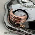 Minimalist rose gold metallic hair tie with crescent design and high-elasticity black rope - Diameter approx 7.5CM / Rose Gold