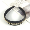 Detail of black velvet headband featuring a prominent gold chain link decorative overlay - Black Chain
