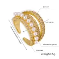 Detailed macro view showing multilayer copper ring with white pearls and zircons - Size 7 (Adjustable) / Gold