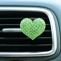 Close-up of heart-shaped car air vent clip with glittering green rhinestones - Green Heart