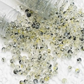 Macro shot of 8mm transparent glass flower beads with black and yellow spots for DIY jewelry - 8mm Spotted Beads / Black & Gold