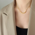 Minimalist gold-plated smile necklace with curved tube pendant on a female model - Curved Style (P678) / 40+5cm / Gold