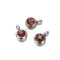 Detailed view of silver stainless steel earring charms with faceted brown zircon gemstones - 10 Pieces per Pack / Steel Border Orange Brown Stone