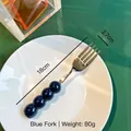 Blue creative bead-handle 304 stainless steel dessert fork on a white plate - Fork / Blue