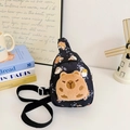 Kids black crossbody bag featuring a cute brown plush bear patch and cartoon patterns - Black