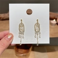 Elegant gold drop earrings with diamond oval ring and clear crystal tassel fringe - Long Crystal Tassel Style (1975)