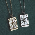 Vintage gold and silver tarot star necklaces with mother of pearl on green texture - Star / Gold