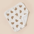Detail of white cotton baby bib with brown bear print and pom-pom trim texture - Bear Head And White