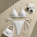 Flat lay of white textured bikini set with adjustable halter neck and side tie bottoms - S / White