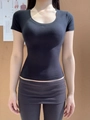 Slim fit black U-neck short sleeve T-shirt for women featuring stretchy hourglass silhouette - XS / Black