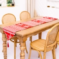 Red Christmas table runner with white knitted snowflake patterns and decorative tassels - Red Snowflake