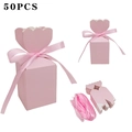 Detailed view of 50pcs pink tulip-shaped gift boxes with ribbons and flat-packed cardboard - Solid Pink + Pink Ribbon
