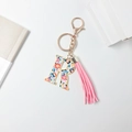 Floral letter R keychain in gold metal with a stylish pink tassel and hook - Letter R (With Tassel)
