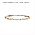 Vista ravvicinata di un bracciale elastico bicolore con perle da 4 mm in oro e argento - Misto Oro Argento 4mm