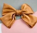 Elegant bronze satin oversized bow hair clip with silky texture and gold brown finish - Orange (Spring Clip)