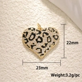 Detail view of heart pendant with leopard pattern and dimensions 23mm by 22mm - Gold Large Leopard Heart