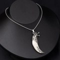 Detailed close-up of retro wolf fang pendant on silver box chain for men's fashion - Large White Wolf Tooth