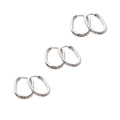 Detailed view of three pairs of oval silver hoop earrings with polished metallic finish - Steel Color - 3 Pairs Set