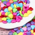 Macro shot of 1.2cm colorful acrylic heart beads for DIY jewelry with 2mm hole - Small Solid Heart Shape Mixed Colors