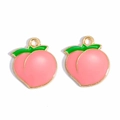 Detail of pink enamel peach charms with golden borders and green leaves for DIY jewelry - Pink Peach
