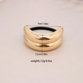 Polished gold alloy bow hair tie with dimensions 5cm diameter and 2.5cm height - #22-Curved Tubular