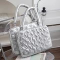 Silver quilted laptop bag set with bow pattern and padded handles on stylish chair - 15 Inch / Silver Bowknot