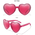 Fashionable hot pink heart shaped sunglasses in translucent plastic for trendy street style - Hot Pink