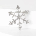 Elegante broche de copo de nieve plateado con diamantes de imitación en soporte blanco - Plateado