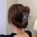 Silver bear hair claw clip with pearl accents on brown hair for elegant styling - Bear Silver