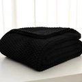 Thick knit blanket in deep black featuring fringe details and soft chunky texture - Black