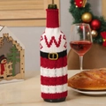 Christmas knitted wine bottle cover in red and white stripes with Santa belt decoration - Letter W