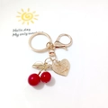 Golden keychain with red cherry pendants and heart-shaped charm on a white surface - Red Cherry with Engraved Heart Plate (Cherry S)