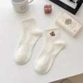 Creamy beige crew socks with brown bear embroidery and elastic ribbed knit texture - Capybara - Thinking / 1 Pair