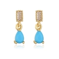 Macro view of 18K gold teardrop earrings with turquoise stones and clear crystals - Teal