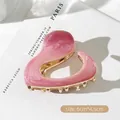 Pink marble heart hair claw clip with golden teeth, dimensions 6cm by 4.5cm - Pink