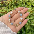 Elegant 18k gold plated beaded bracelet with blue stones, pearls and relief coin charm - Sky Blue