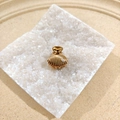 Golden shell-shaped hair claw clip with pearl accent on a decorative crystal base - Pearl Shell Clip