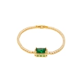 Macro detail of gold tennis bracelet with a large green rectangular zircon gemstone - Gold Green Zirconia