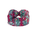 Red paisley yoga headband with a twisted knot design and colorful floral patterns - Red Paisley
