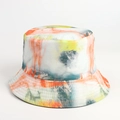 Detailed view of tie-dye bucket hat stitching and vibrant orange-yellow artistic fabric - Dark Green Orange