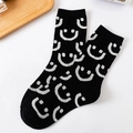 Black cotton crew socks with white smiley face patterns and ribbed elastic cuffs - One Size / Black All-over Smiley Style