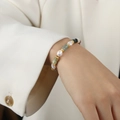 Elegant Baroque freshwater pearl bracelet with green gemstone beads on a female wrist - 16cm / Freshwater Pearl Natural Stone