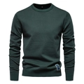 Détail du col rond côtelé et de la texture en maille de coton d'un pull-over vert foncé - Vert