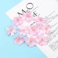 Detailed macro view of artificial light pink plum blossoms for DIY hair accessories - Pink