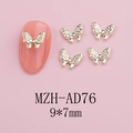 Detailed view of golden metal butterfly nail charms with rhinestones sized 9x7mm - Gold Diamond-Like Butterfly (AD76)